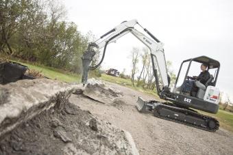 Bobcat E42 and breaker attachment breaks up a concrete curb.