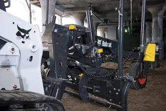 Sonic/slope system mounted on a Bobcat T770 compact track loader.