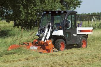 Bobcat flail Cutter Attachment on 5600 Toolcat cuts through thick grass.